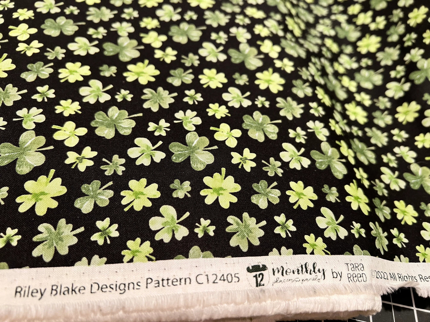 Shamrocks black background - Riley Blake -  100% Cotton Fabric.    Sold by the yard only!